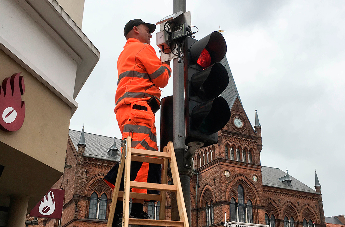 Technician installing sensor nodes in Vejle